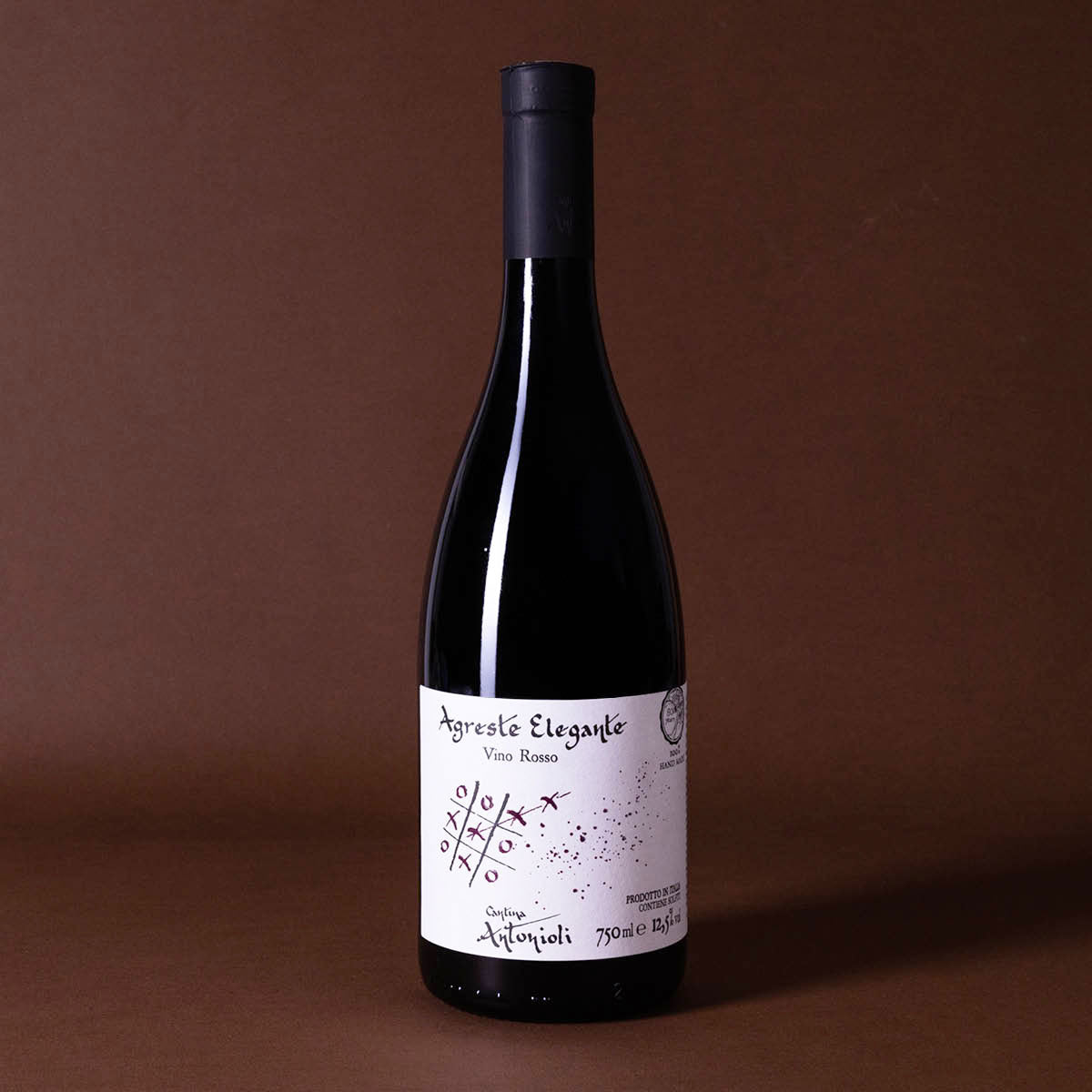 Full bottle of Agreste Elegante by Cantina Antonioli, an artisanal natural red from Valtellina, showcasing high-altitude Nebbiolo grown on steep stone terraces