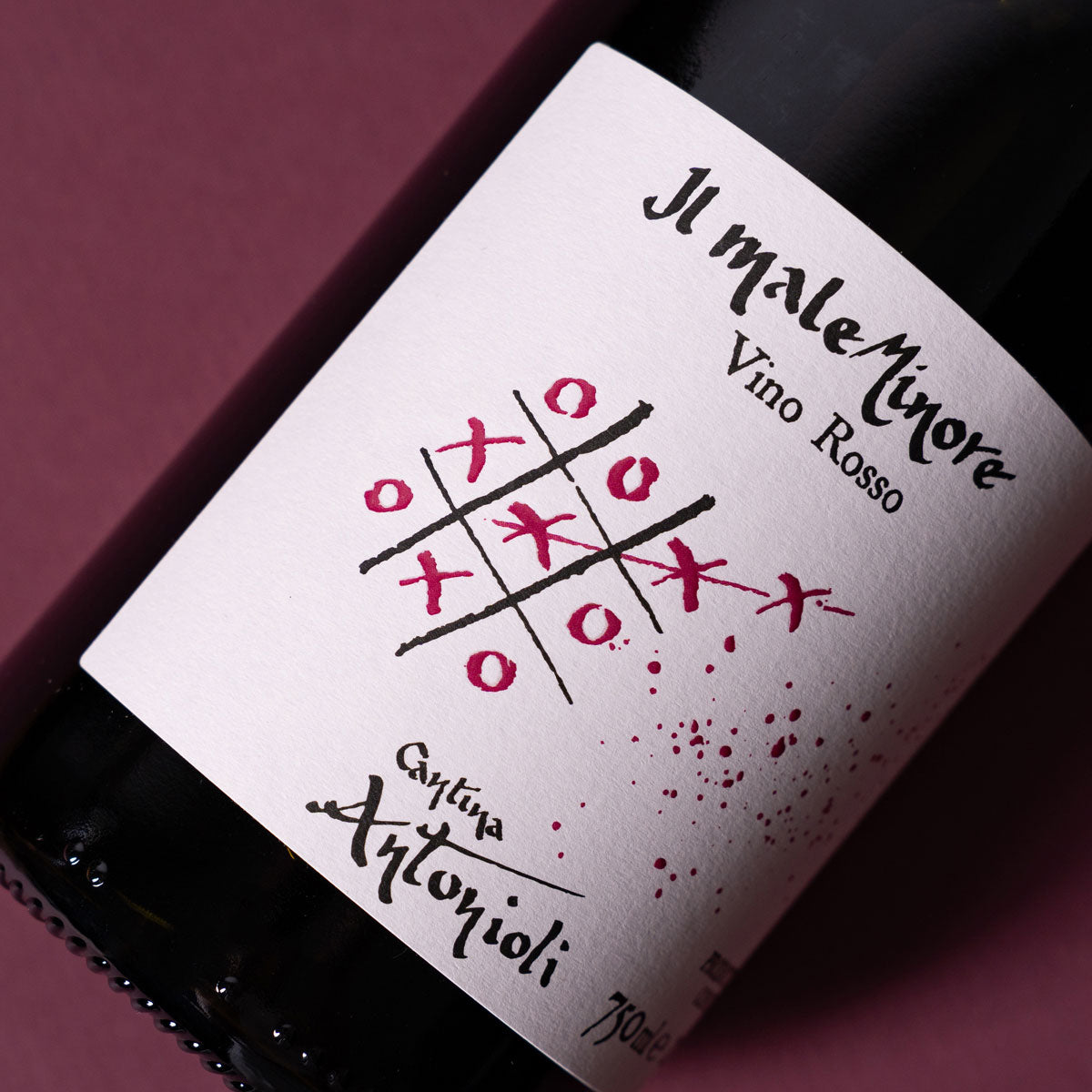 Close-up of Cantina Antonioli Il Male Minore label, a natural red wine made from Chiavennasca (Nebbiolo) in Valtellina — showcasing minimalist design and alpine authenticity