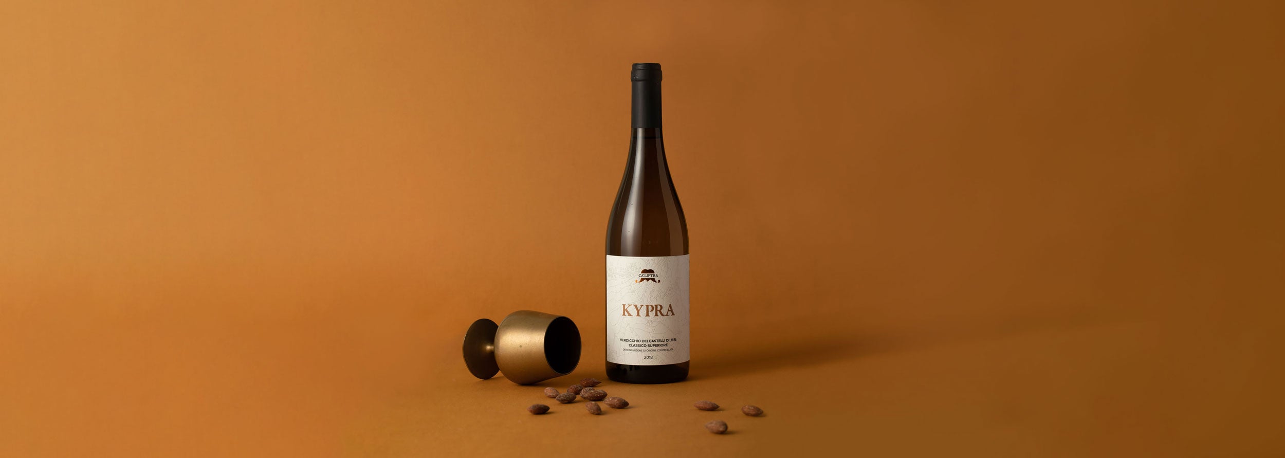 Styled image of Ca’Liptra’s Kypra wine from Marche, Italy - a natural, organic Verdicchio from Cupramontana, highlighting the artisanal character of small-batch Italian white wines