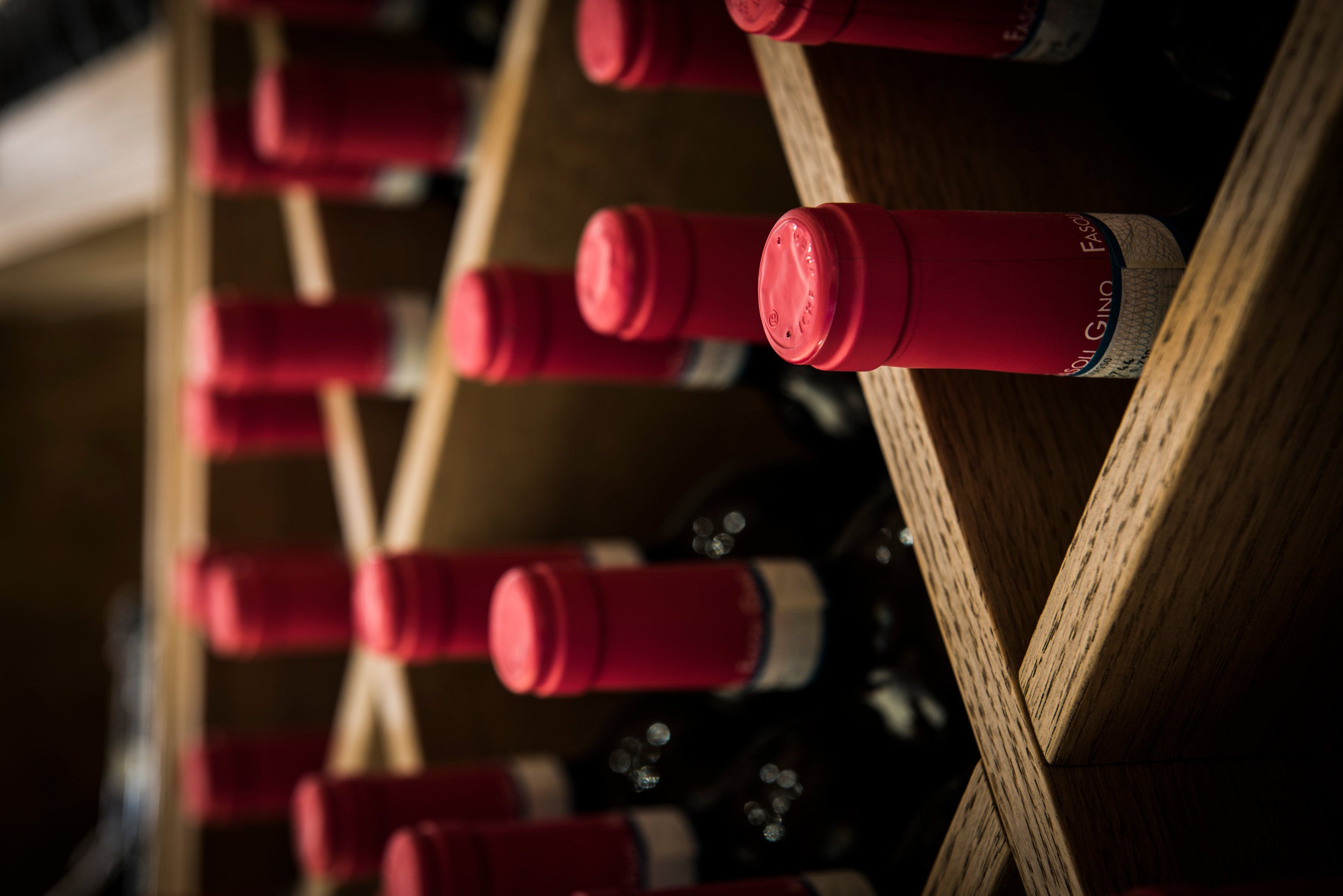Top view of Fasoli Gino Amarone bottles stored in a wine rack — showcasing biodynamic red wine from Veneto, aged with care and tradition