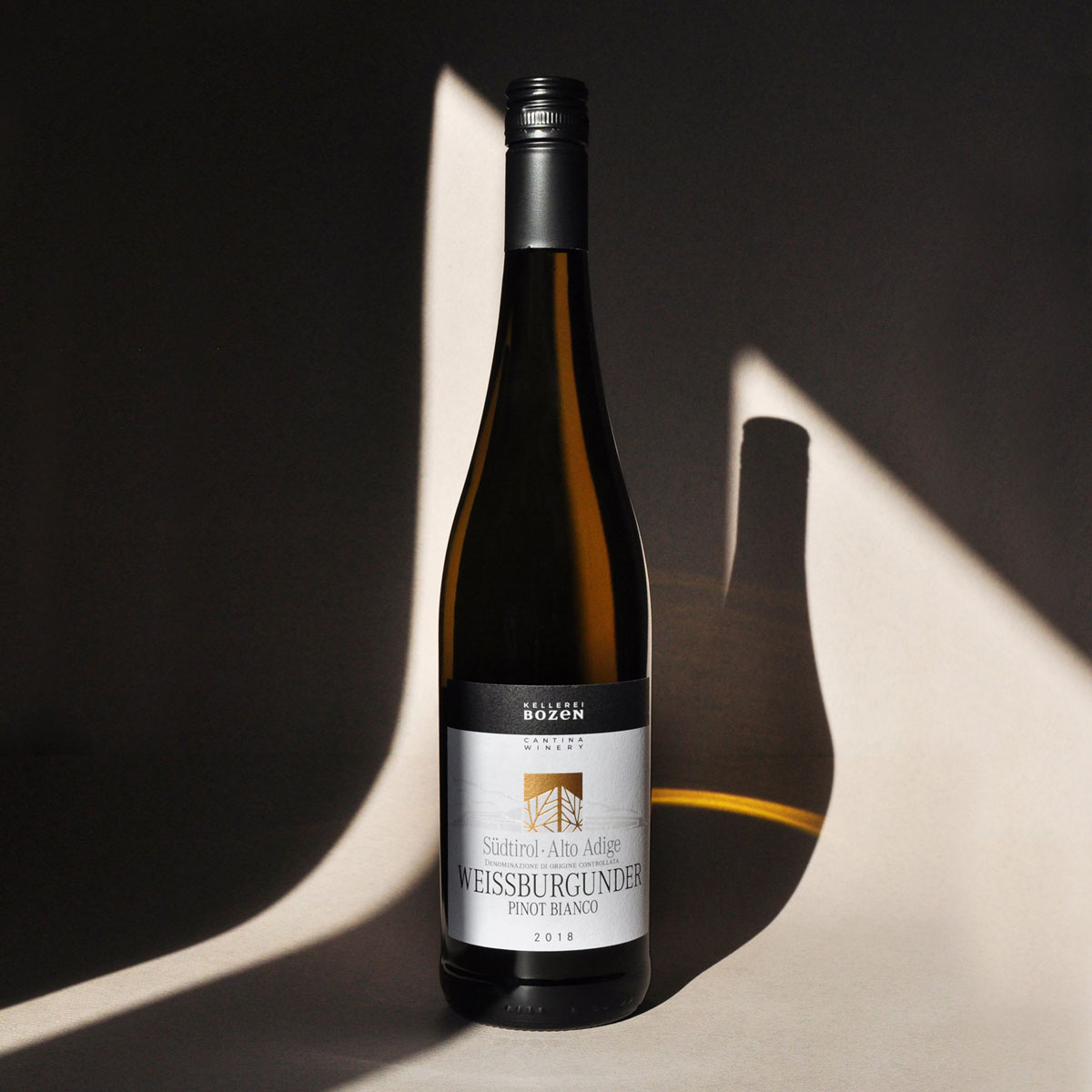 Styled image of Kellerei Bozen’s Pinot Bianco — a clean, vibrant Italian white wine from Alto Adige, perfect for aperitifs and light seasonal dishes