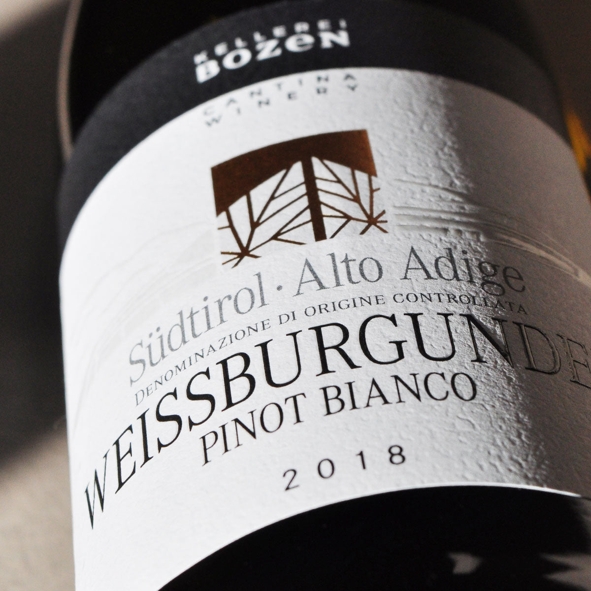 Close-up of Kellerei Bozen Pinot Bianco label — a sustainable white wine from Alto Adige, showcasing purity, freshness, and Alpine elegance