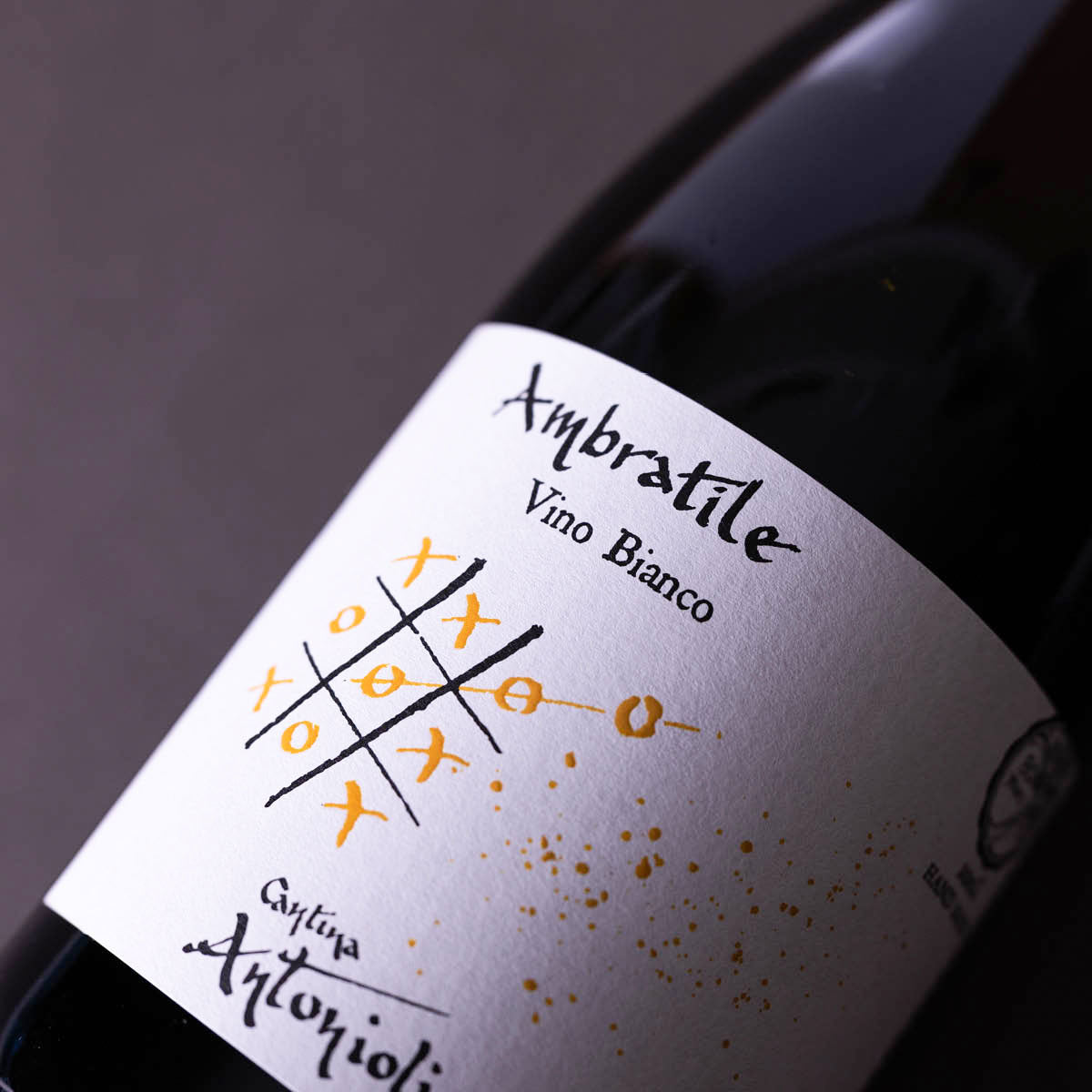 Close-up of Cantina Antonioli Ambratile label, a natural white wine from Valtellina — handcrafted with alpine freshness and traditional minimal-intervention winemaking