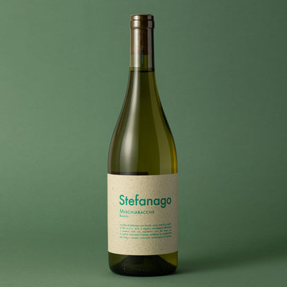 Styled image of Castello di Stefanago’s Mischiabacche Bianco — an expressive natural white wine from Oltrepò Pavese, reflecting the estate’s wild farming and lo-fi winemaking approach