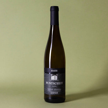 Styled image of Kellerei Bozen’s Kerner — a vibrant and expressive Italian white wine from Alto Adige, ideal for pairing with herbs, seafood, and light fare