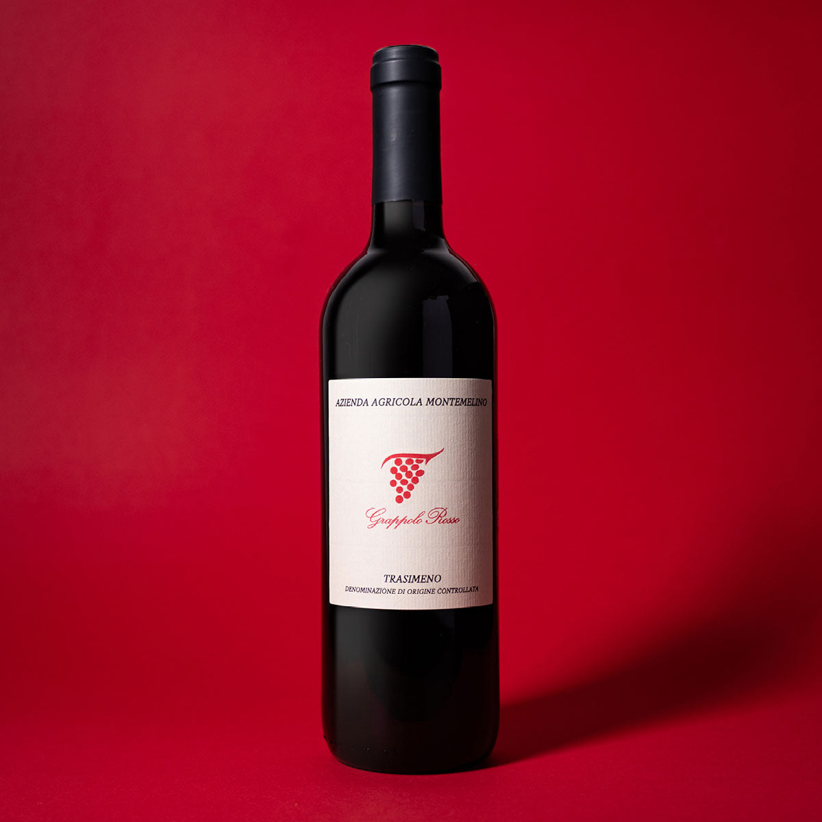 Styled image of Montemelino’s Grappolo Rosso — a rustic and honest Italian red wine, ideal for simple meals and regional cuisine