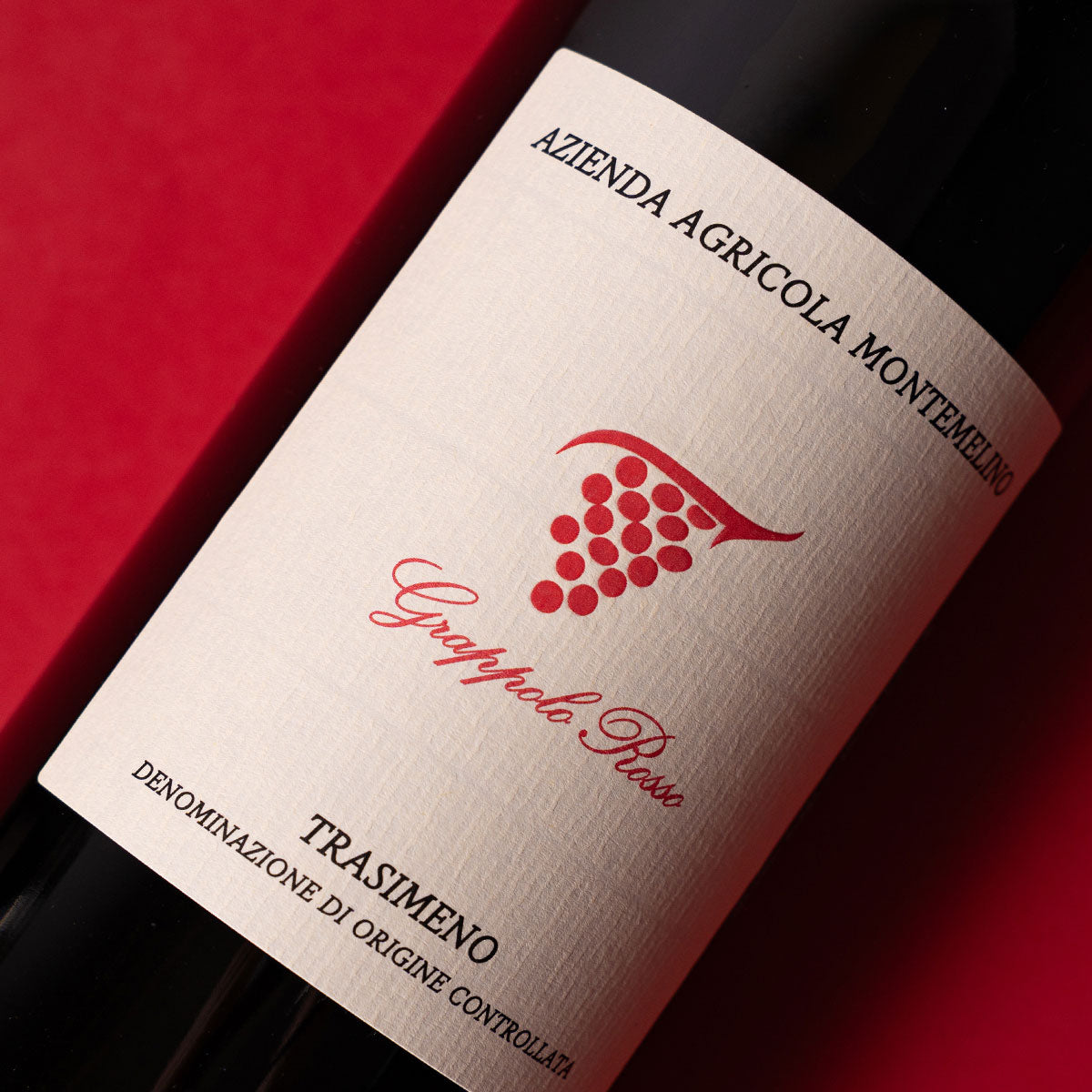 Close-up of Montemelino Grappolo Rosso label — an organic red wine from Umbria, reflecting traditional winemaking and native grape expression